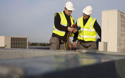 Thermodial engineers examine refrigeration gauges